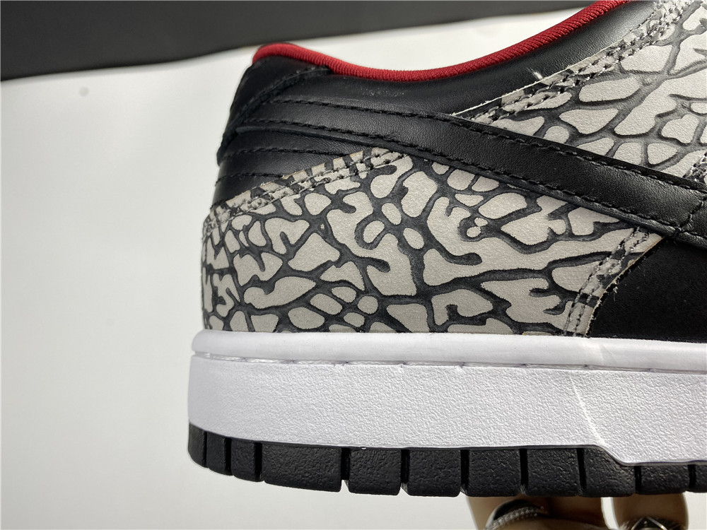 from Supreme × Nike SB Dunk Low “Black Cement 304292-131
